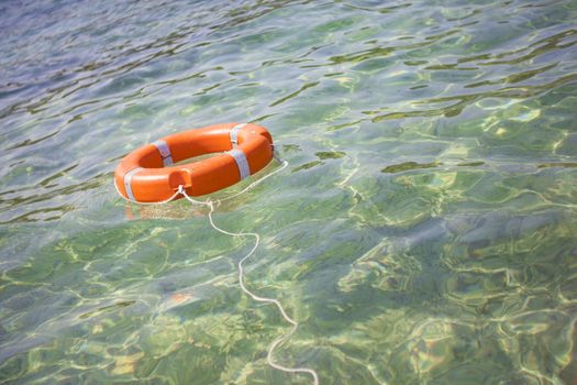 Life buoy on transparent sea for safe