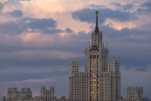  Moscow Russia on against dramatic sunset sky. Building of Stalin's era.