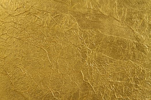 texture of the wall, covered with a thin gold foil, with beautiful folds and fissures