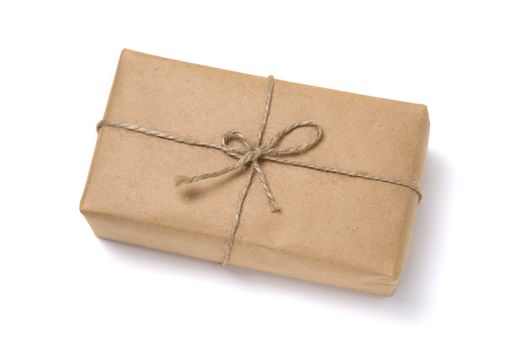 Christmas gift box wrapped in kraft paper. Isolated on white background