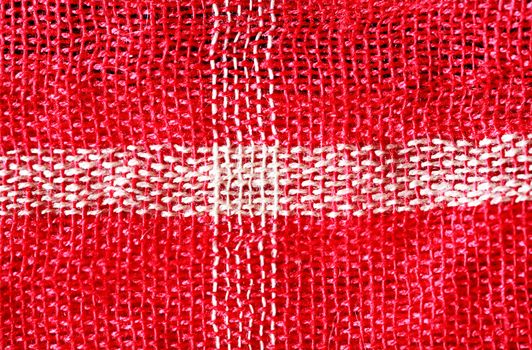 Bright cloth background. Closeup of red and white Middle East fabric