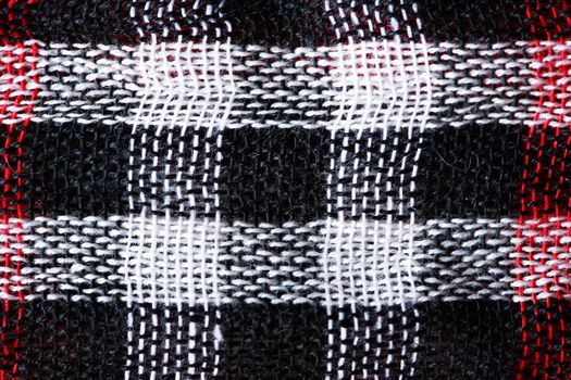 Bright cloth background. Closeup of black and white Middle East fabric