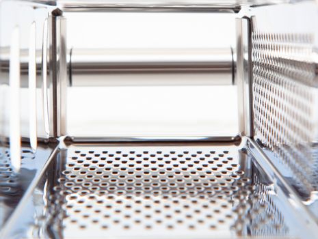 Grater blade. Texture of the chrome metal blades. Inside view of the tool close up