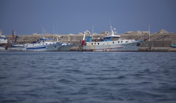 Old Fishing boats moored in Bagnera Port in Sicily