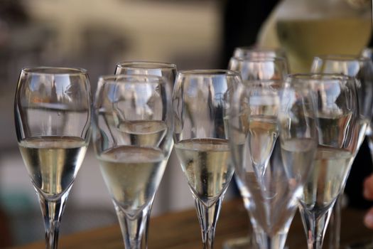 Glass glasses with prosecco - setting up the glasses on the table in the restaurant for an aperitif