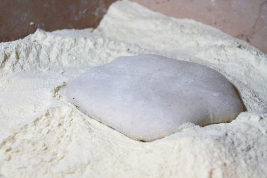 the dough is ready to be seasoned and baked for pizza