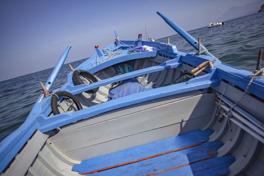 Blue Rowboat in transaparent sea of Sicily
