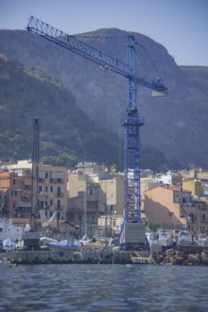 Cranes in Banghera Port at sunset