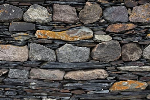 old wall built of different stones