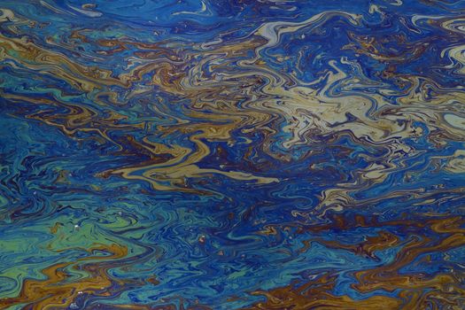 background of an oil slick on water showing the brilliant colors