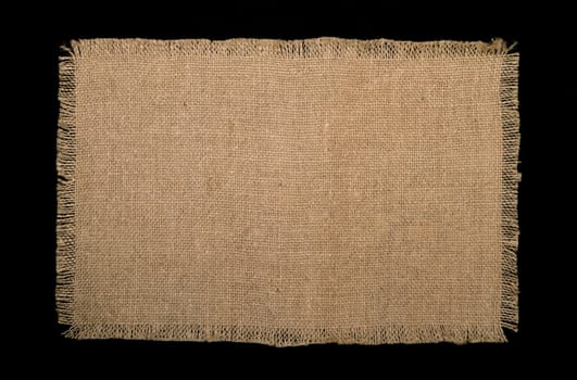 texture of coarse burlap on black background