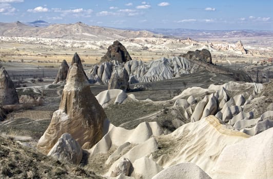 strange mountain valley, tuff stone formations in cappadocia, turkey.