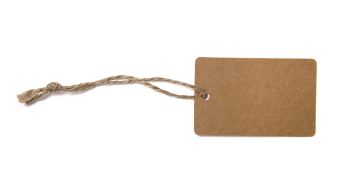 Blank tag tied with brown string isolated against a white background