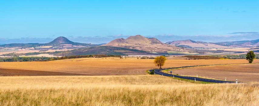 Landscape of Ceske Stredohori, aka Central Bohemian Highlands, with typical spiky hills of volcanic origin, Czech Republic.