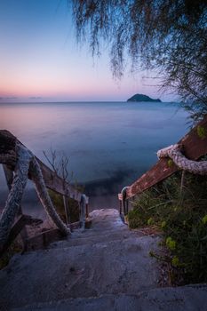 Stone steps leading to beautiful turquoise Mediterranean sea