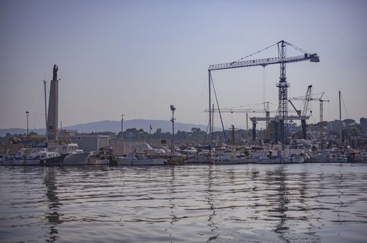 Cranes in Banghera Port during sunset