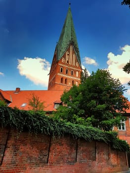 Lüneburg, Germany, Dom and old historic houses with blue sky and clouds in the background