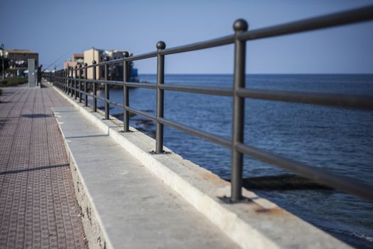 Railing on the sea at Porticello in Sicily