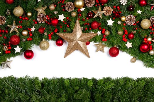 Christmas Border frame of tree branches around white background with copy space isolated, red and golden decor, berries, stars, cones