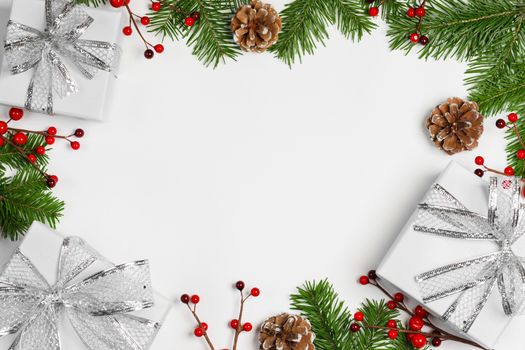 Christmas background with balls and decorations of holly berry, cones, gifts, balls on white