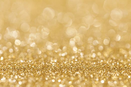 Shiny golden bokeh glitter lights abstract background, Christmas New Year party celebration concept