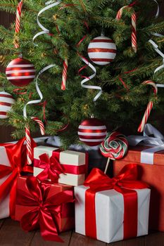 Decorated Christmas tree and gift boxes background