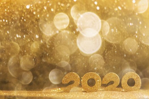 2020 New Year luxury design concept. Golden 2020 New Year horizontal template with golden glitter backgound
