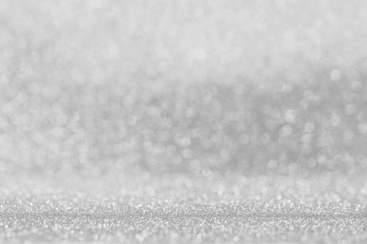 Shiny silver bokeh glitter lights abstract background, Christmas New Year party celebration concept