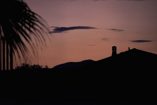 Silhouette of houses at sunset in Sicily