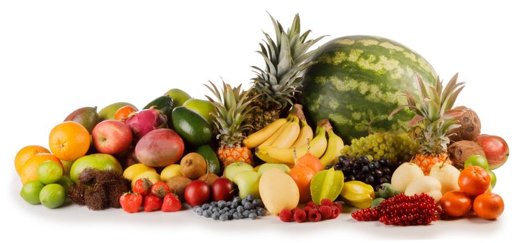 Fresh tropical fruits harvest pile isolated on white background with copy space for text
