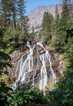 Bertha falls, Landscape of the Waterton Lakes National Park with blue sky, Alberta, Canada