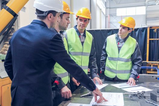 CNC machine shop with lathes, technicians and workers