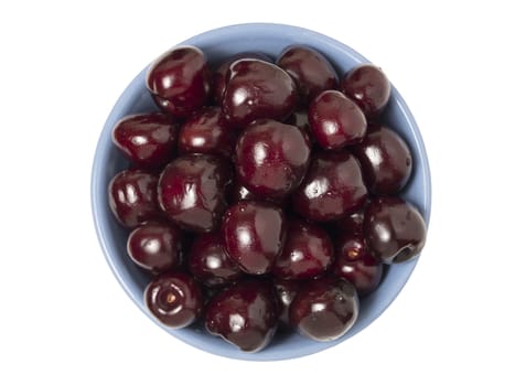 Fresh ripe cherries in bowl. Isolated on white background. Top view.