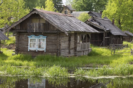 The beautiful small wooden houses on the river bank, Myshkin city, Russia.