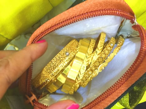 a collection of gold jewelry