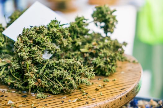 cannabis sativa dried marijuana closeup on table .