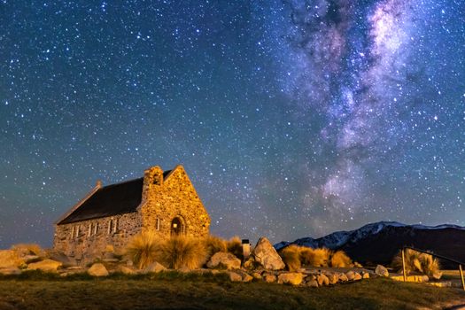 Milky Way Rising Above Church Of Good Shepherd, Tekapo NZ with Aurora Australis Or The Southern Light Lighting Up The Sky . Noise due to high ISO; soft focus / shallow DOF due to wide aperture used.