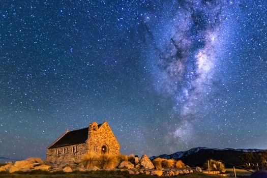 Milky Way Rising Above Church Of Good Shepherd, Tekapo NZ with Aurora Australis Or The Southern Light Lighting Up The Sky . Noise due to high ISO; soft focus / shallow DOF due to wide aperture used.