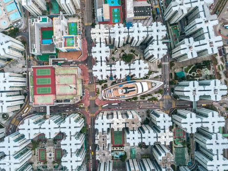 Top view aerial photo from flying drone of a HongKong Global City with development buildings, transportation, energy power infrastructure. Financial and business centers in developed China town