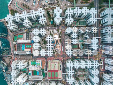 Top view aerial photo from flying drone of a HongKong Global City with development buildings, transportation, energy power infrastructure. Financial and business centers in developed China town