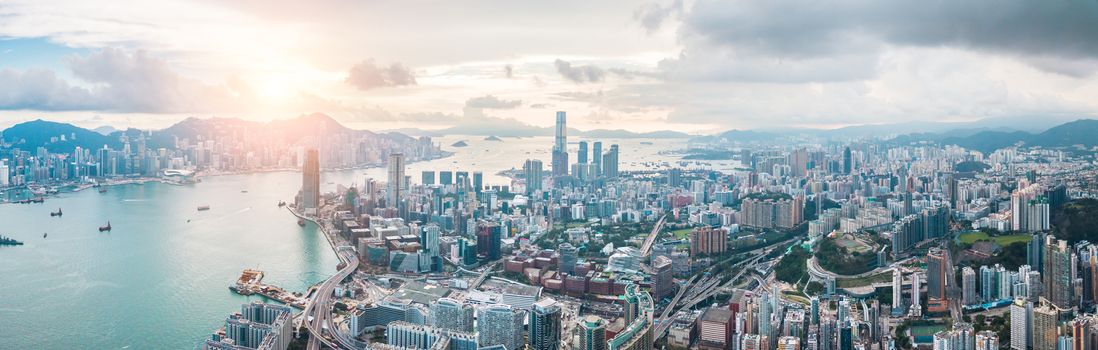 Top view aerial photo from flying drone of a HongKong Global City with development buildings, transportation, energy power infrastructure. Financial and business centers in developed China town