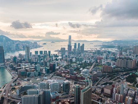 Top view aerial photo from flying drone of a HongKong Global City with development buildings, transportation, energy power infrastructure. Financial and business centers in developed China town