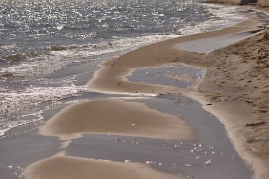 Water and sand at the sea in Marina di Butera, Sicily