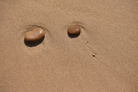 Pebbles on Sand in a beach in Sicily