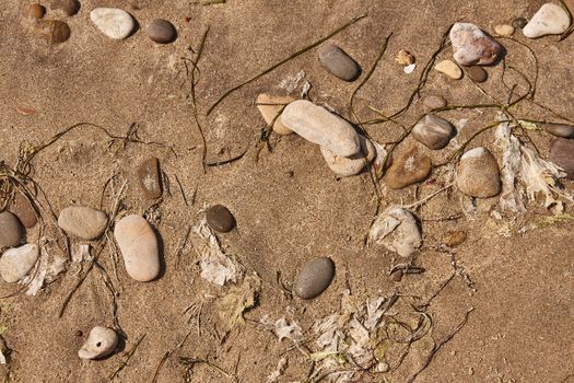 Pebbles on Sand in a beach in Sicily