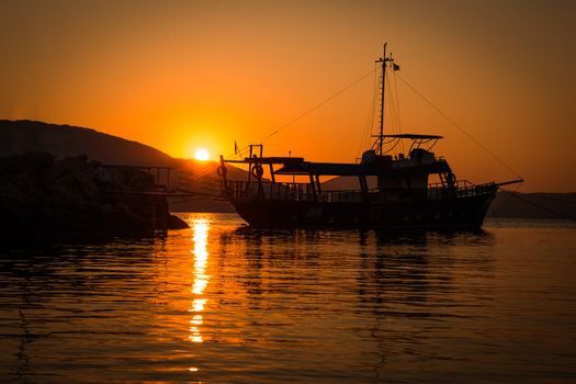 The Fisherman preparing for Sailing for fish at sunrise in sea in the morning in Greece.