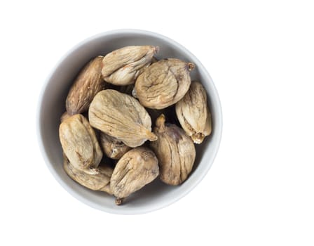Full bowl of dried figs isolated on white background. Top view.