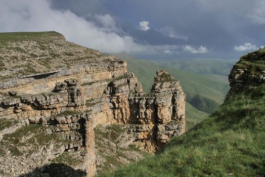 Rocky Mountains cliff and clouds fog. Nature landscape.