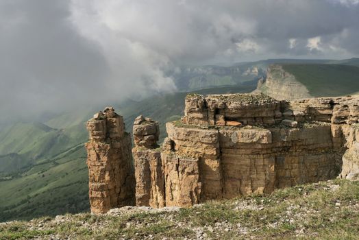 Rocky Mountains cliff and clouds fog. Nature landscape.