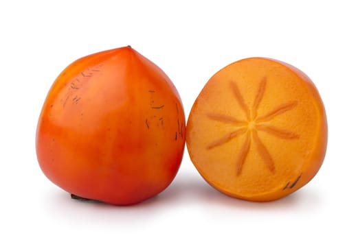 ripe persimmon, a whole fruit and a half, isolated on white